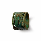 Third Intermediate Period, circa 1069-735 B.C. With the reserved figure of a seated falcon-headed deity holding the Maat feather, a stylised lotus blo...
