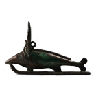 Late-Ptolemaic Period, 664-30 B.C. Modelled in the round on a sledge attached by ventral and pectoral fins, a forked tail, a dorsal ridge, and a taper...