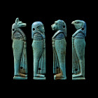 25th Dynasty, circa 747-656 B.C. Set of four flat-backed plaques depicting the standing figures of the four sons of Horus (from left to right: Duamute...