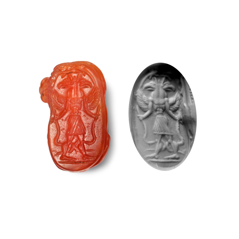 Phoenician Carnelian Scaraboid with Lion. 6th-4th century B.C. Carved in the hal...
