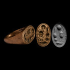 New Kingdom, 18th Dynasty, 1353-1336 B.C. A 'stirrup' type ring with a substantial oval-shaped bezel bearing the name of Pharaoh Akhenaten - Nefer-khe...