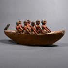 Middle Kingdom, late 11th-early 12th Dynasty, 2010-1961 B.C. Comprising a cream-coloured crescent-shaped boat manned by a crew of seven oarsmen, each ...