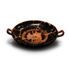 5th century B.C. With short stem and broad bowl with carination at the shoulder; two strap handles with an ivy-leaf with tendrils and volutes undernea...