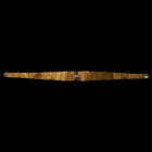 1st millennium B.C. Sheet-gold with tapering finials, central raised cell set with a two-tone glass insert imitating banded agate; mounted on perspex ...