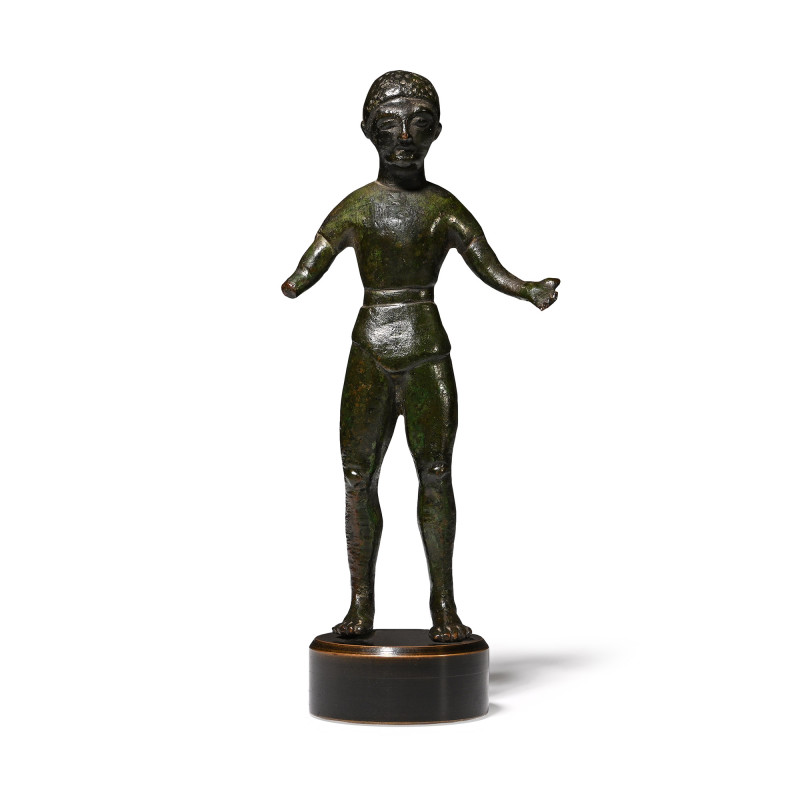 Iberian Bronze Statuette. 6th-4th century B.C. Youthful male standing wearing a ...