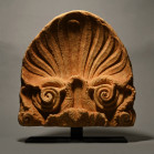 4th century B.C. Carved in the form of an elaborate palmette with stems in the form of spiral tendrils rising from acanthus leaves, a small rosette at...