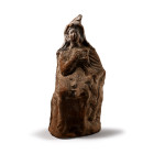 Greek Terracotta Seated Shepherd. Circa 400 B.C.