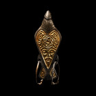 Viking Silver-Gilt Bird Pendant with Bearded Mask. 9th-10th century A.D.