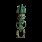 Egyptian Blue Glazed Pataikos Statuette. Third Intermediate Period, 1069-702 B.C.