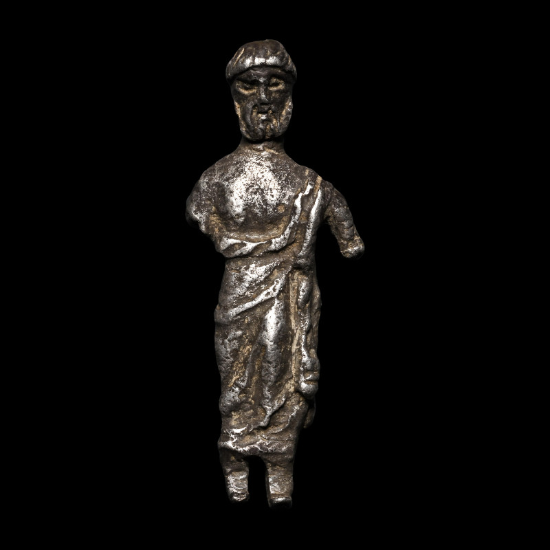 Roman Silver Figure of a Man. 2nd-3rd century A.D. Standing erect wearing a drap...