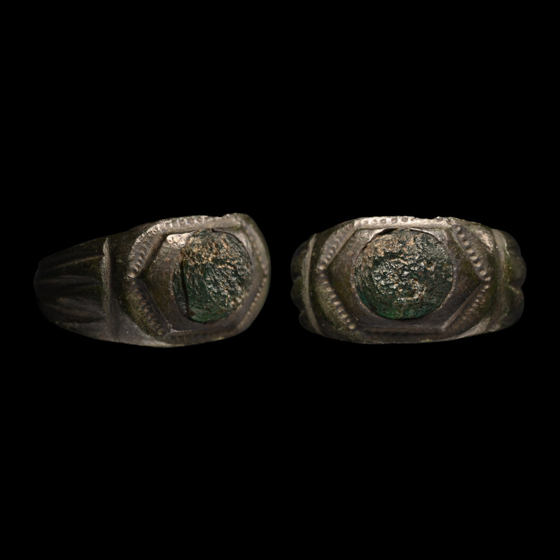Roman Bronze Ring with Cabochon. 2nd-4th century A.D. Slender hoop with wide flu...