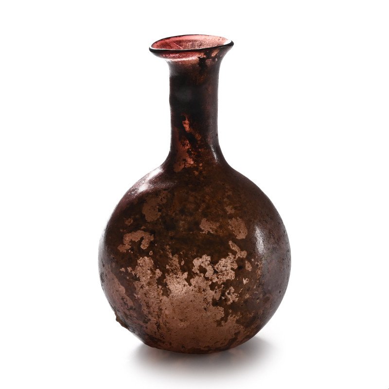 Roman Aubergine Glass Bottle. 2nd-4th century A.D. With bulbous body, tubular ne...