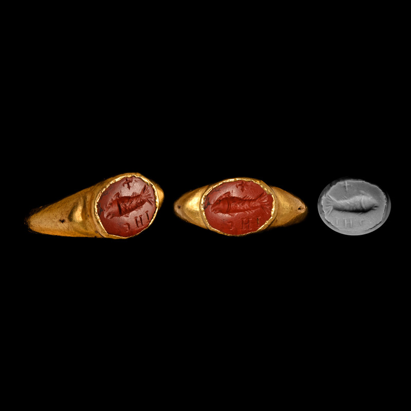 Roman Gold Ring with IHS and Fish Gemstone. 3rd-4th century A.D. Hollow-formed h...