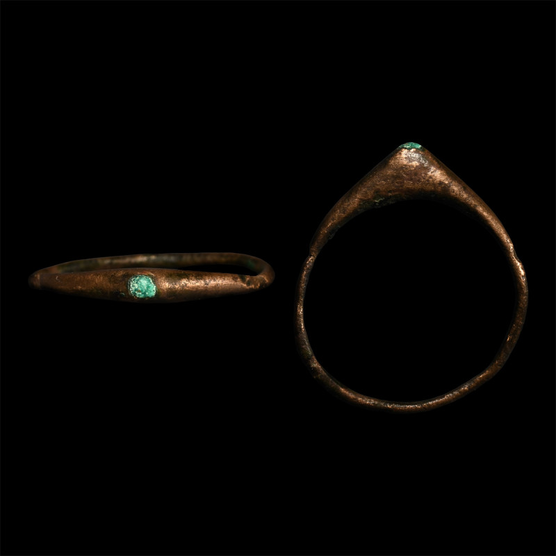 Medieval Bronze Stirrup Ring with Turquoise Gemstone. 13th century A.D. With a s...