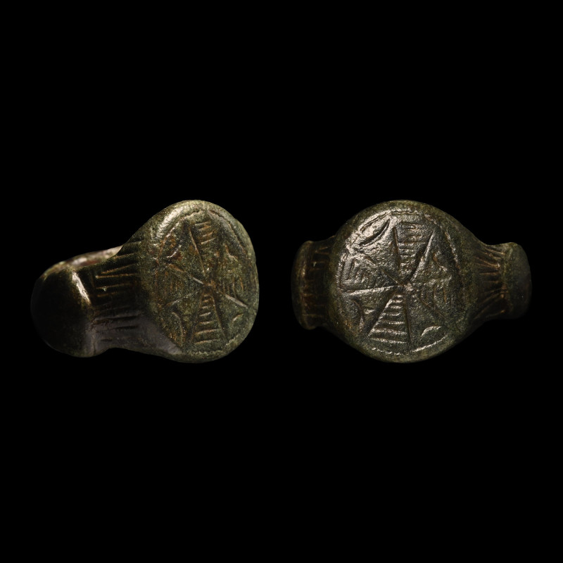 Medieval Bronze Ring with Expanding Cross. 14th-15th century A.D. Comprising a w...