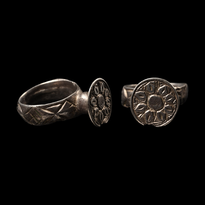 Medieval Silver Ring with Sunburst Design. 14th-15th century A.D. Comprising a k...