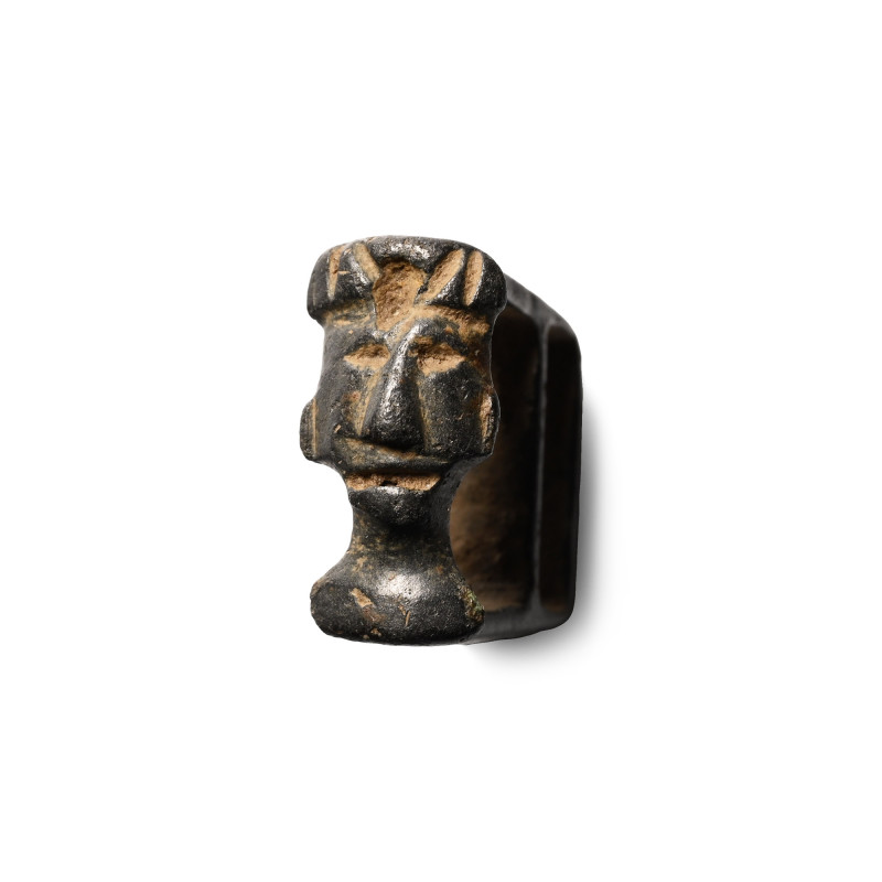 Medieval Bronze Strap Fitting with Bust. 1350-1450 A.D. Trapezoidal in elevation...