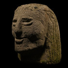 Larger Than Lifesize Celtic Style Stone Head. 20th century A.D.