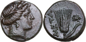 Greek Italy. Southern Lucania, Metapontum. AE 14 mm, c. 300-250 BC . Obv. Head of Demeter right, wearing wreath of grain. Rev. META. Ear of barley wit...