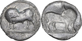 Greek Italy. Southern Lucania, Sybaris. AR Stater, 550-510 BC. Obv. Bull standing left, head right; in exergue, VM. Rev. Incuse of the obverse, no leg...