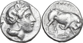 Greek Italy. Southern Lucania, Thurium. AR Nomos, 400-350 BC. Obv. Head of Athena right, wearing helmet decorated with Scylla. Rev. Bull butting right...