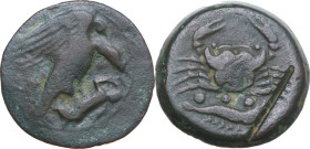 Sicily. Akragas. AE Tetras or Trionkion, c. 425-410 BC. Obv. AKPA. Eagle standing right on hare, head lowered, wings open. Rev. Crab; below, three pel...