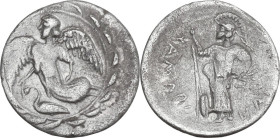 Sicily. Kamarina. AR Litra, c. 461-435 BC. Obv. Nike flying left; below, swan; all within wreath. Rev. KAMARI-NAION. Helmeted Athena standing left, ho...