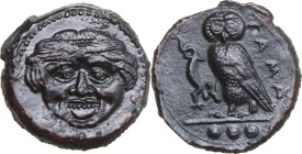Sicily. Kamarina. AE Tetras, 425-405 BC. Obv. Facing gorgoneion with protruding tongue. Rev. KAMA. Owl standing left, head facing, wings closed, holdi...