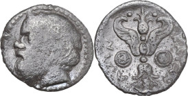 Sicily. Katane. AR Litra, c. 430-415/3 BC. Obv. Bearded head of Silenos left, wearing ivy-wreath. Rev. ΚΑΤΑΝ-ΑΙΩΝ. Winged thunderbolt; shields to left...