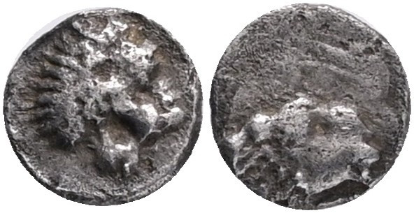 CARIA, Uncertain. circa 400-340 BC. AR Tetartemorion . Head of ram right / Roari...