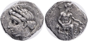 CILICIA. Uncertain. (4th century BC).AR obol. Obv: Laureate head of Apollo(?) left. Rev: Baaltars seated right, holding lotus-tipped scepter in right ...