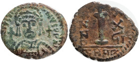 Justinian I, 527-565 AD. AE Decanummium, Theupolis. Obv.: DN IVSTINIANVS PP AVG, helmeted, cuirassed bust of Justinian I facing, holding cross on glob...