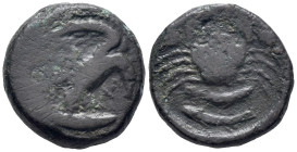 Sicily, Akragas, c. 425/0-410/06 BC. Æ Hexas (19mm, 6.63g). Eagle, with head lowered, standing r. on fish. R/ Crab; two fish below; two pellets on eit...