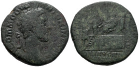 Commodus (177-192). Æ Sestertius (30mm, 20.64g). Rome, 181. Laureate head r. R/ Commodus seated l. on curule chair set on platform, extending hand; of...