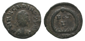 Arcadius (383-408). Æ (14mm, 1.16g). Cyzicus, 378-383. Pearl-diademed, draped and cuirassed bust r. R/ VOT V within wreath; SMK[…]. RIC IX 20d. VF
