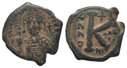 Justinian I (527-565). Æ 20 Nummi (27mm, 7.77g). Nicomedia, year 32. Helmeted and cuirassed bust facing, holding globus cruciger and shield; cross to ...