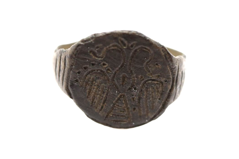 Medieval- probably Byzantine bronze finger ring with the stylized image of two h...