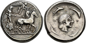SICILIA. 
SYRACUSE. Tetradrachm, about 520-500. AR 17.22 g. Slow quadriga r., the driver, wearing long chiton, standing r., holding the reins with hi...
