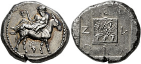 MACEDONIA. 
MENDE. Tetradrachm, about 450-430. AR 17.34 g. Dionysos, bearded and crowned with ivy, nude to waist, wearing himation, reclining on the ...