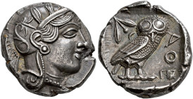ATTICA. 
ATHENS. Tetradrachm, about 420-400. AR 17.16 g. Head of Athena r., wearing Attic helmet with crest, orned with three olive leaves and floral...