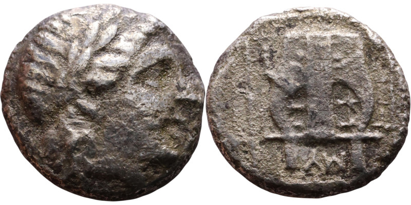 Greek Silver coin. (IV-I century BC) Obverse: Head of Apollo. Reverse: Lyre

1...