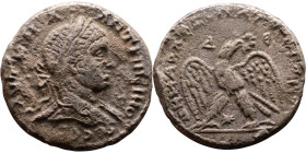 Elagabalus (218-222) Tetradrachm. Obverse: Bust of emperor. Reverse: Eagle standing left, head right, wreath in beak, tail right, wings spread