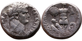 Titus (Caesar) Caesarea Maritima Obverse: Laureate head of Titus, right  Reverse:  Trophy; at foot left, a crouching captive with arms tied behind; on...
