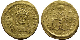 Justinian I (527-565) Constantinople Solidus. Obverse D N IVSTINIANVS P P AVC. Helmeted and cuirassed bust facing, holding cross on globe and shield R...