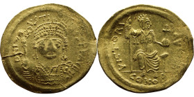 Justinian I (527-565) Constantinople Solidus. Obverse D N IVSTINIANVS P P AVC. Helmeted and cuirassed bust facing, holding cross on globe and shield R...