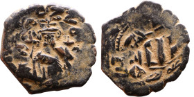 Constans II (641-668) Follis. Obverse: Imperial figure holding cross and globus Reverse: m and inscription
