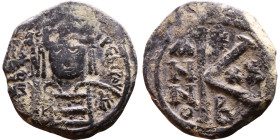 Maurice Tiberius (582-602) Half Follis. Obverse: Helmeted and cuirassed bust facing, holding globus cruciger and shield., Reverse: Large K above cross...