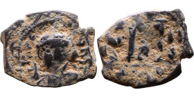 Constans II (641-668) Follis. Obverse: Imperial figure holding cross and globus Reverse: m and inscription