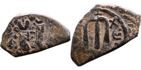 Constans II (641-668) Follis. Obverse: Imperial figure holding cross and globus Reverse: m and inscription