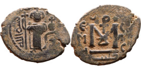 al-Malik ibn Marwan (687-705), Byzantine style folis Obverse: Imperial figure holding globe and cross Reverse: M and inscription